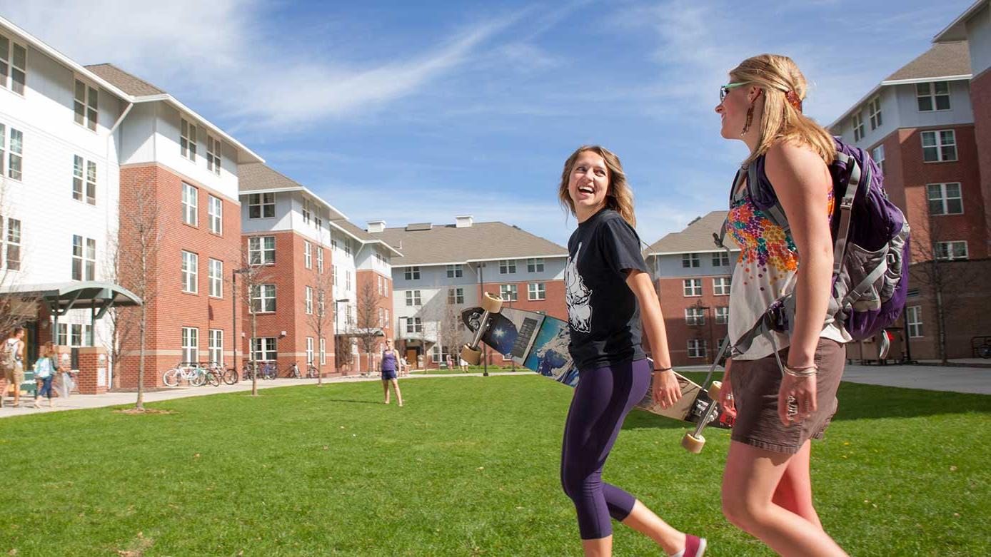 Students walking in front of the LLCs