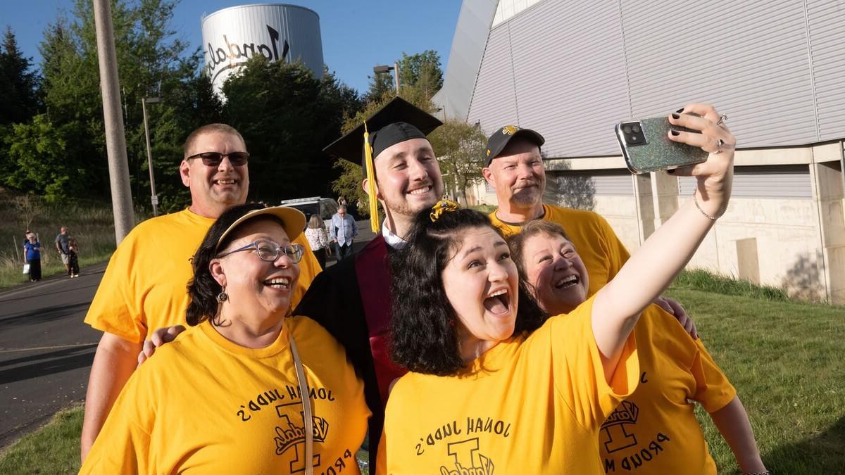 Family celebrating graduation with their new Vandal alum.